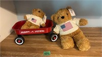 Red wagon with two teddy bears