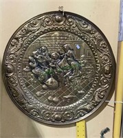 Large brass hanging platter measures 25 inches