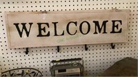 Wooden sign with four hooks measures 30 inches