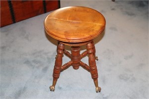 Antique piano stool with glass ball and brass