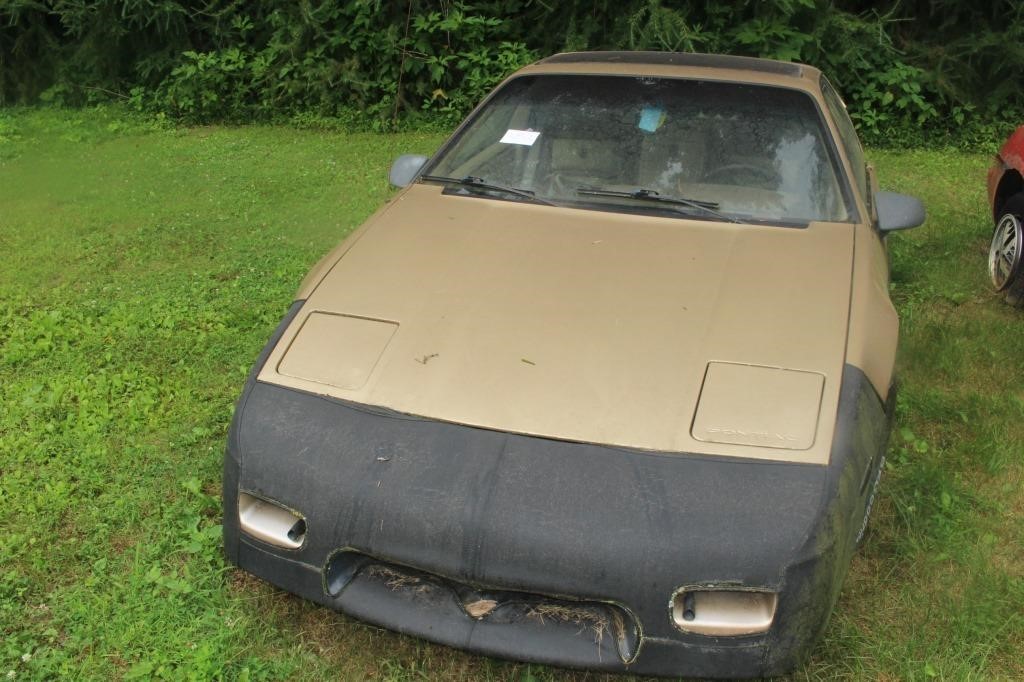 1986 GOLD FIERO WITH TITLE, NOT RUNNING