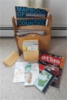 Wood magazine rack with various road maps and