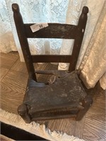 Antique childs chair with leather seat