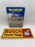 Embossed Monroe and Bosch signs.