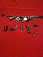 Sterling bracelet and charms. 94 grams.