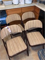 FOUR PADDED FOLDING CHAIRS