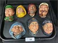7 Painted Chalkware Heads.