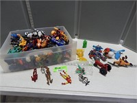 Plastic drawer full of assorted toys