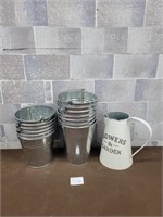 Metal buckets and water can