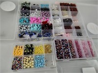 4 organizers filled with craft beads