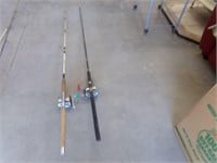 2 large fishing poles with reels