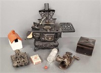 Group of vintage toys including iron stove, meat