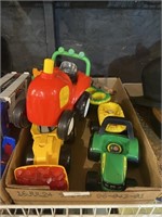 assorted plastic farm tractors