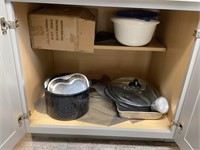 Sorted pots, pans, and plastics, bakeware