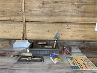 Assortment of concrete tools, stickers, tree