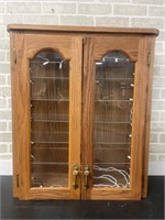 Oak Cabinet with glass shelves and lights. Has