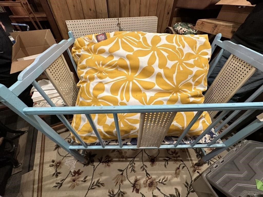 baby crib and dog bed