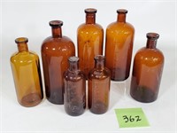 Lot of (7) Old Amber Pharmacy Jars
