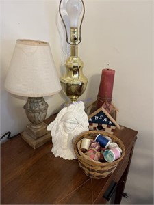Vintage lamps, basket of thread, and a candle