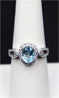 Sterling oval cut blue topaz ring, lab grown