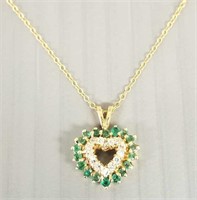 14k gold pendant on 14k chain set with emeralds &