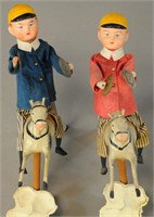 TWO ANIMATED BOYS ON A PONY STICK TOYS