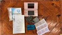 Nintendo DS Lite with charging cord and two