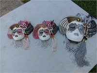 3 Italian porcelain hanging masks.