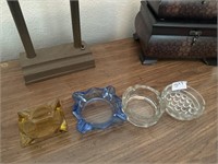Group of vintage ashtrays. One has a chip