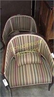 Two matching chairs with lumbar throw pillows