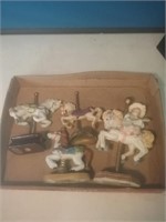 Group of four collectible carousel horses
