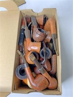 Shoebox full of wooden pipes
