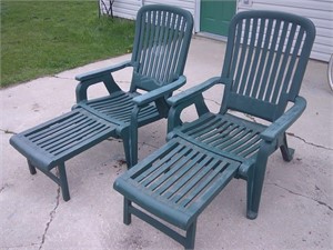 two plastic lounge chairs