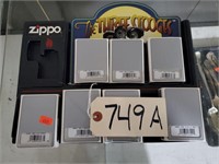 Lot 749A - Seven 3 Stooges Zippo Lighters with