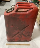 Vintage red metal military gas can