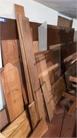 Various Wood Stacked Along Wall Excludes Metal