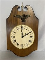 BULOVA WOODEN WALL CLOCK WITH BRASS EAGLE. NEEDS