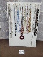 Fashion jewellery necklaces and display board