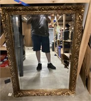 Large double bevel mirror in ornate frame