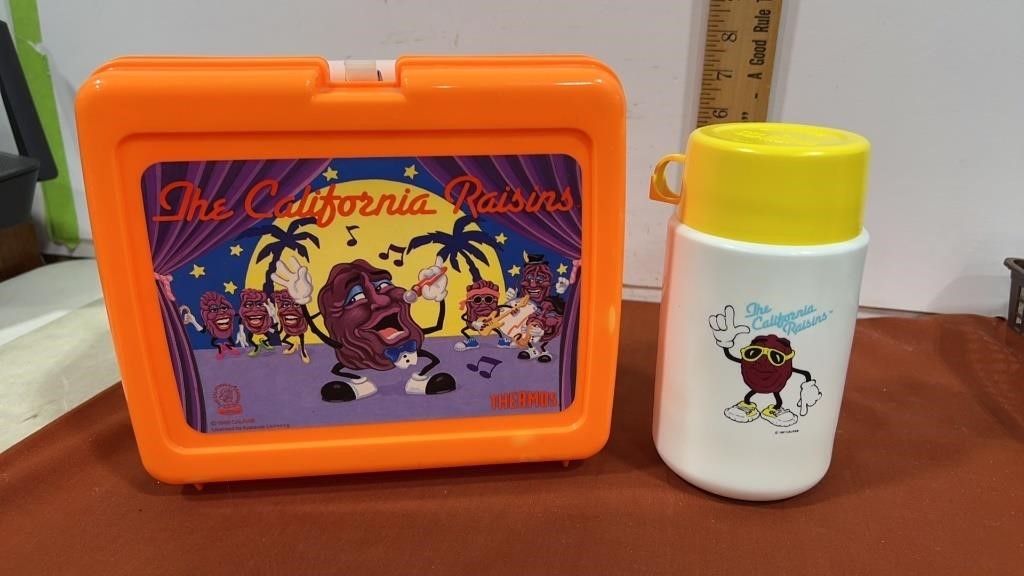 Orange California raisins, lunchbox and thermos
