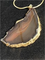 Beautiful banded agate with gold trim on gold