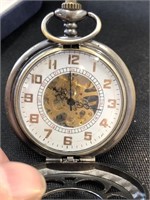 Pocket watch with exposed jeweled movement