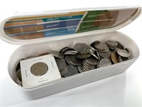 Large cannister of foreign coins mostly Canadian,