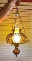 Beautiful amber light fixture on chain that hangs