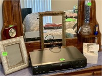 DVD Player with all on top of dresser as