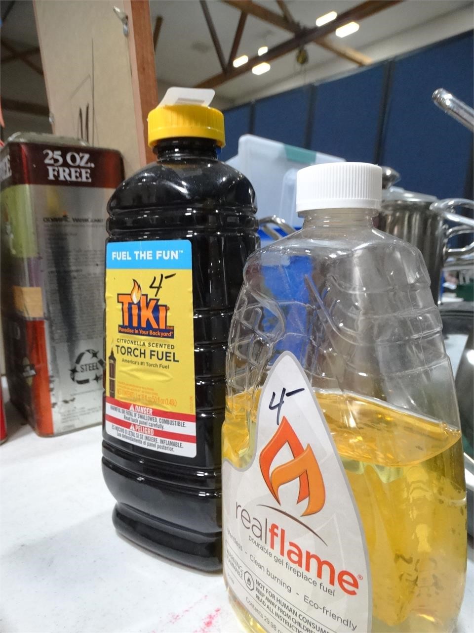 2 Partial Bottles of Tiki Fuel