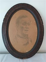 John Wayne print in oval frame, has age damage