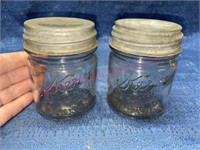 (2) Antique Kerr half-pint jars (zinc lids) clear