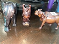 Wood carved elephant, bull and happy Buddha