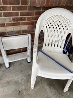 2 plastic yard chairs and a plastic folding